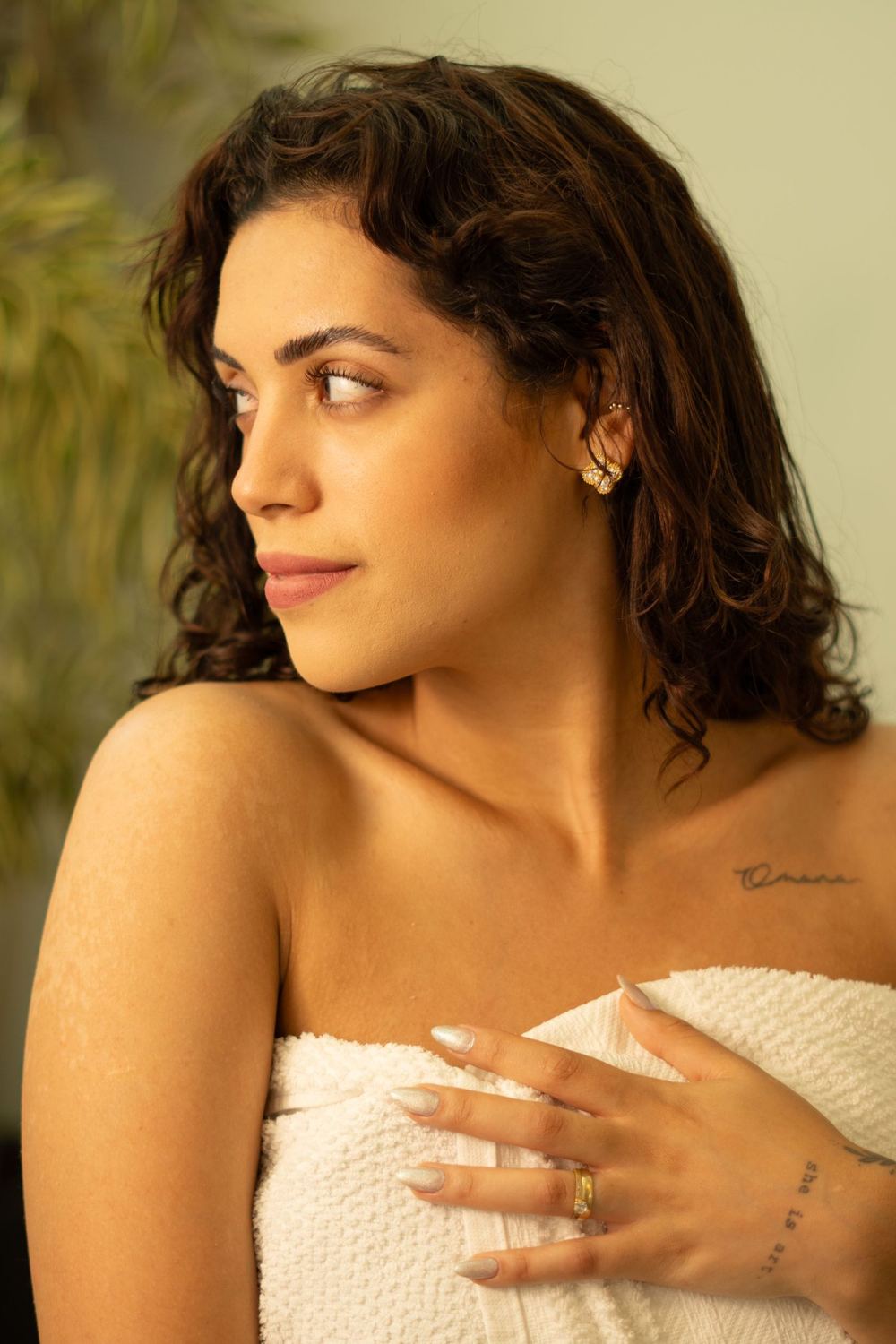 A woman with calm, healthy, naturally radiant skin in soft daylight.