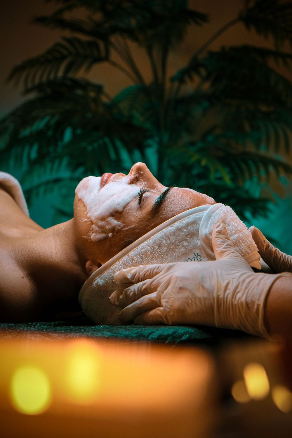 A calm, warmly lit treatment space prepared for a skincare appointment.